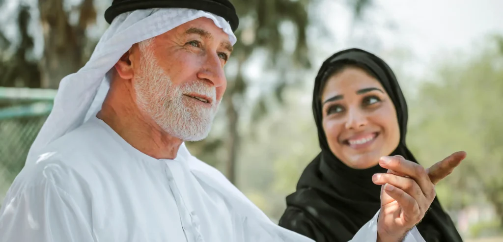 Happy elderly Muslim man preparing for Umrah with joy and gratitude